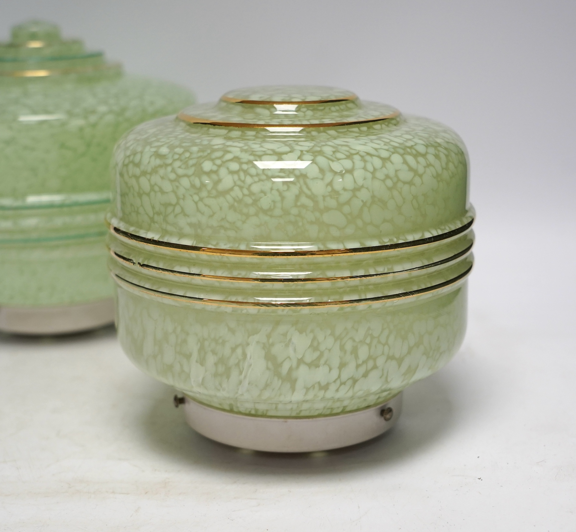 Four Art Deco glass light shades and an earlier glass shade